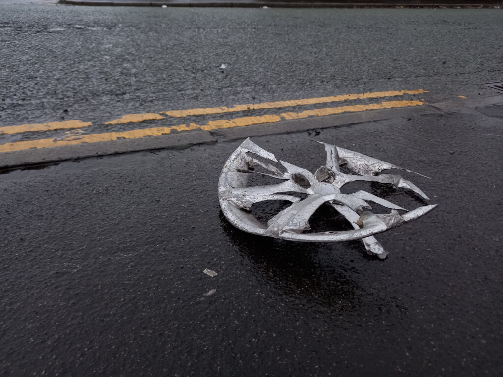 destroyed wheel after a car accident
